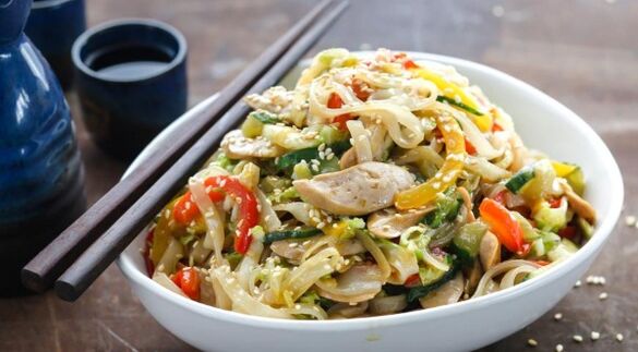 Rice spaghetti with vegetables - the first course of the gluten-free diet menu